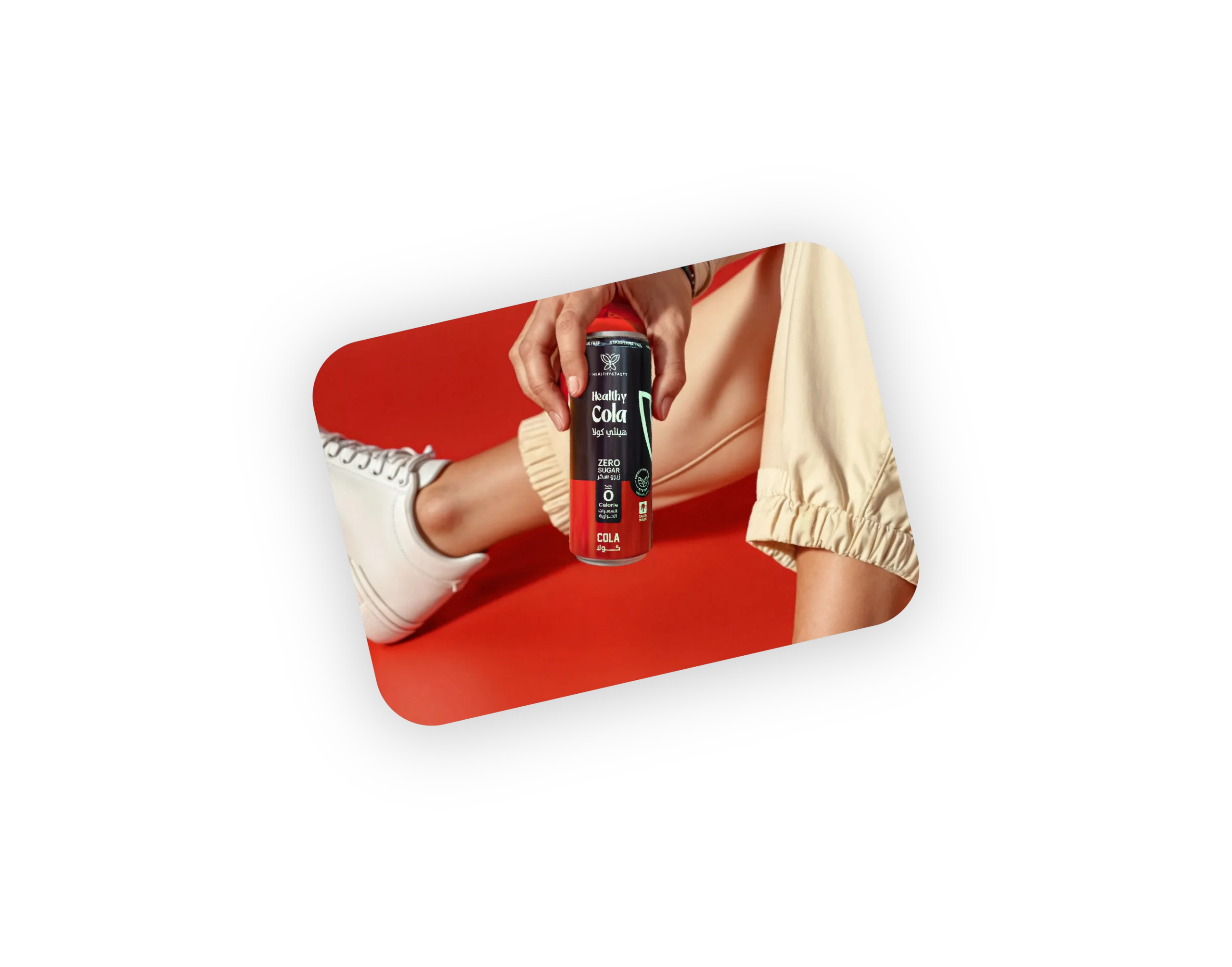 hand holding cola tilted